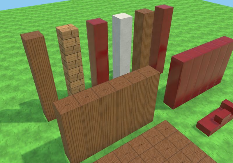 木の色のブロック、朱色の漆、白いしっくいを柱や壁の形に並べたところ